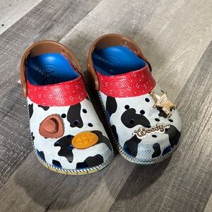 CROCS Kids Cow Print Clogs with Red and Brown Details